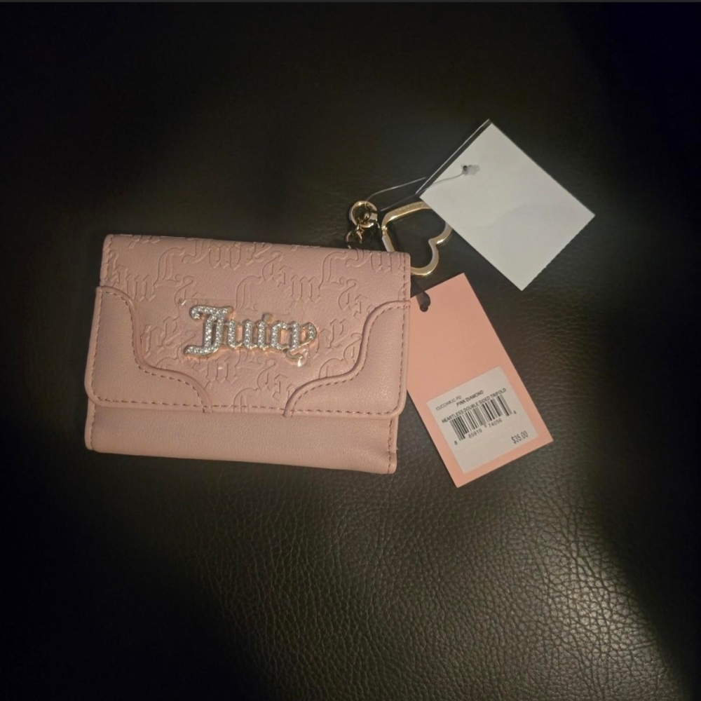 Juicy Couture Light Pink Wallet with Silver Accents and a Coach Backpack